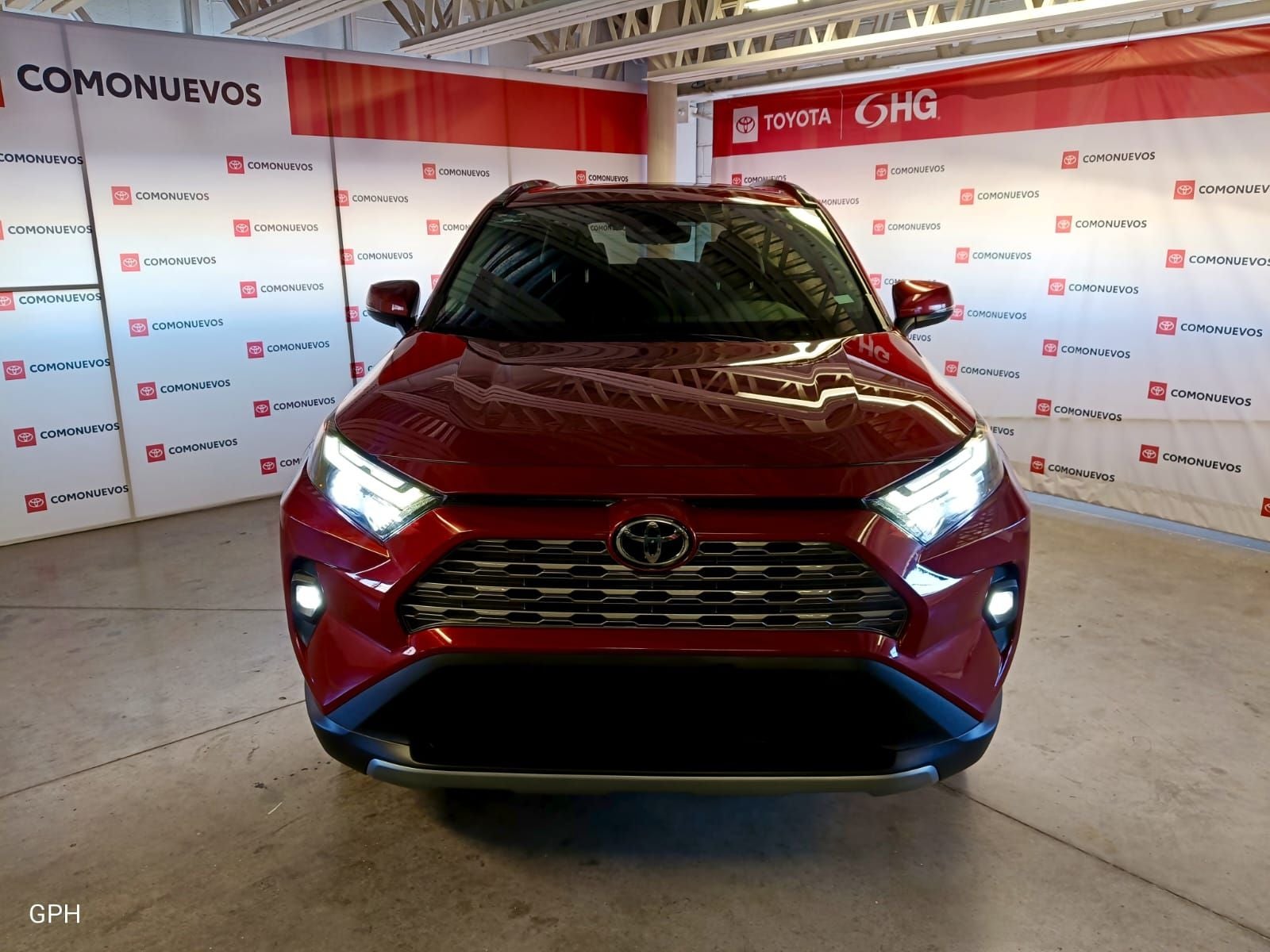 2023 Toyota RAV4 2.5 Limited At in Rojo — front three-quarter view